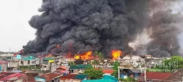 菲律宾描仁瑞拉市仓库突发大火 宣布七级火警